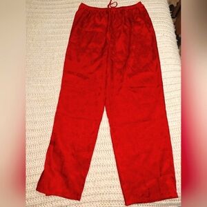 A Set of Enchanted Red Silky ladies pajamas in a large (14-16). EUC.
